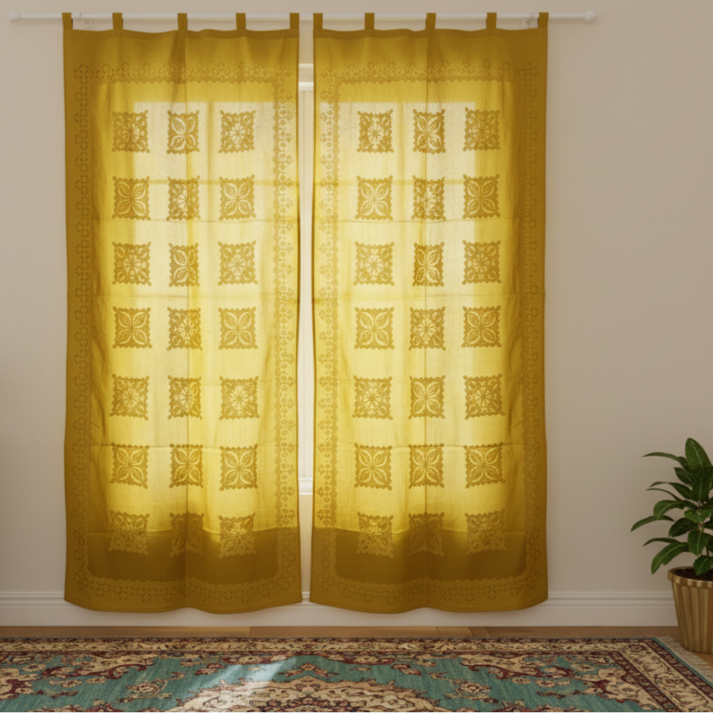 Yellow patterned curtains on a white wall with a plant in the corner.
