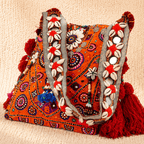 side view of Sunset Hues Orange Shell Detailing Banjara Bag