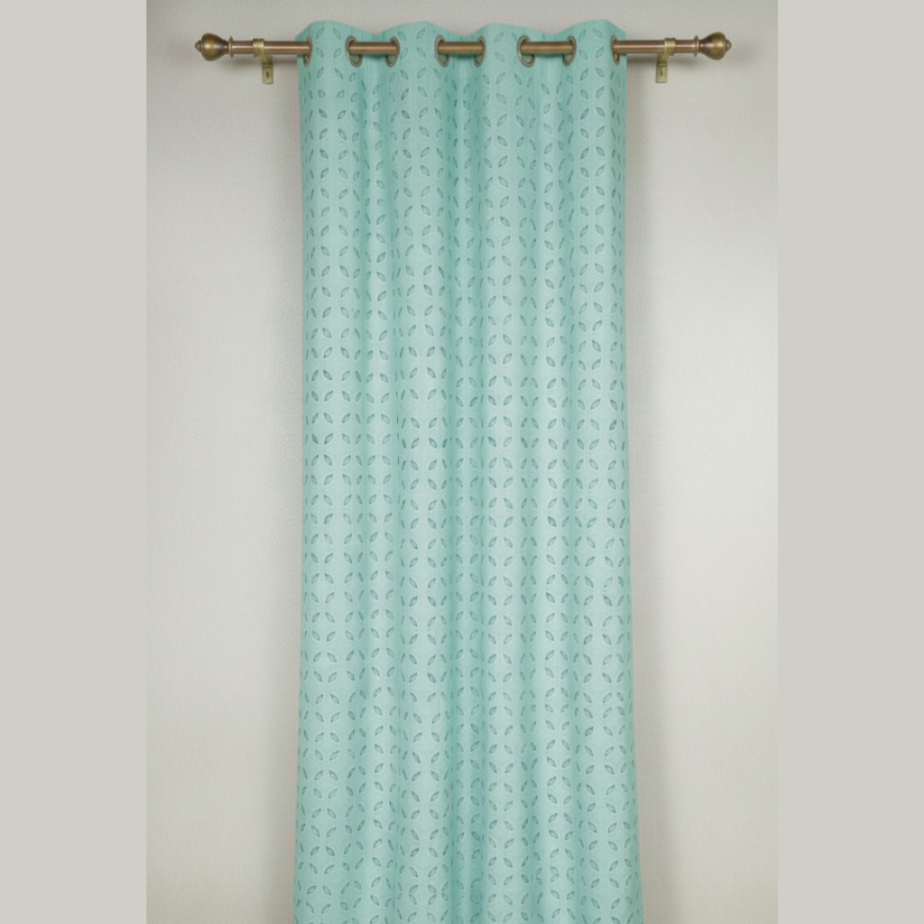 Patterned teal curtain on a gray background