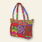 Colorful patterned handbag on a beige background