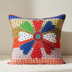Colorful floral-patterned cushion cover on a neutral background