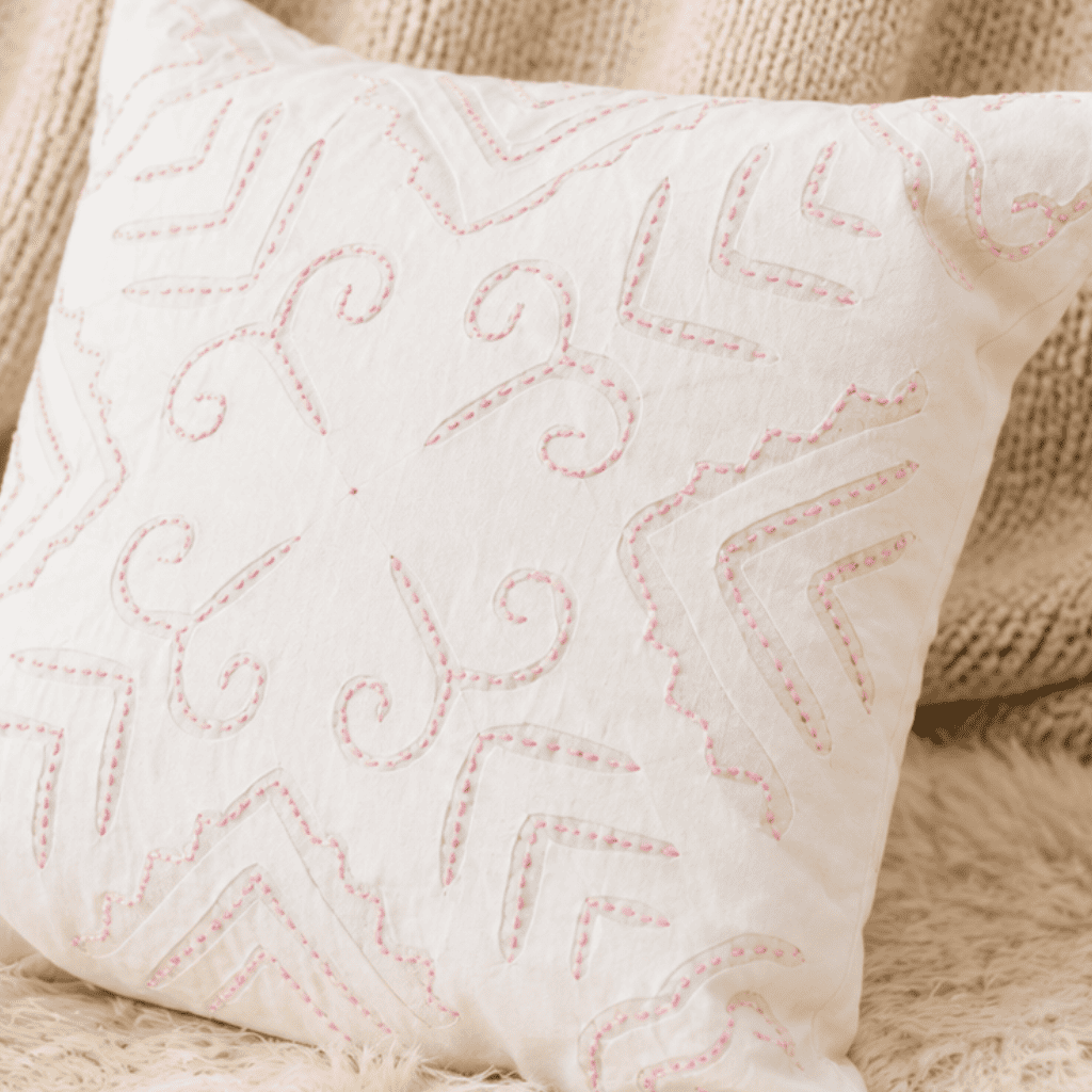 White appliqué cutwork cushion cover for elegant home décor