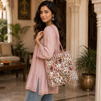 a girl carrying a white printed tote bag