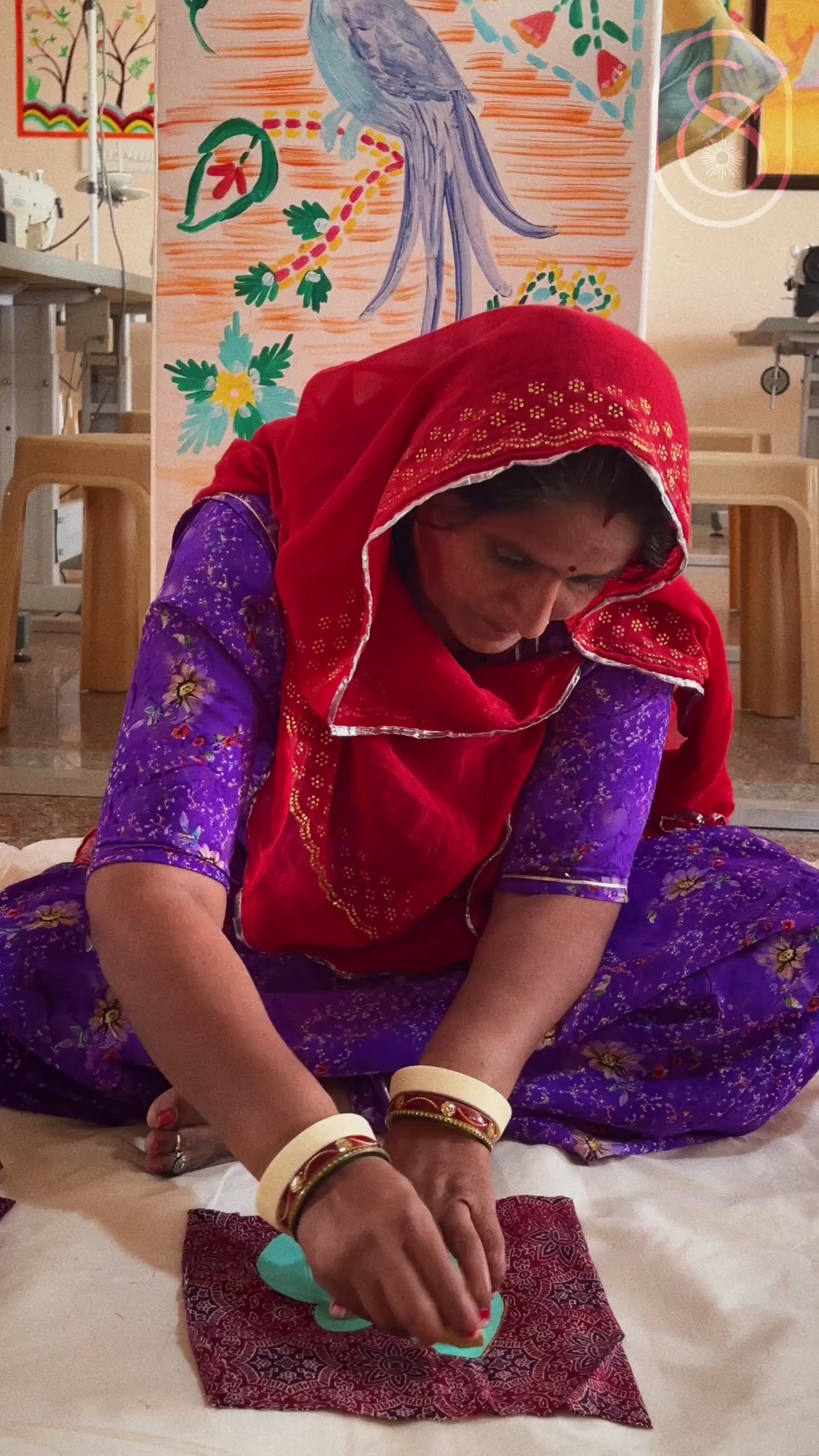 a video showing women artisans working along with a group view of the director explaining the artisans about correct craft techniques